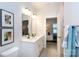 Double vanity bathroom with white cabinets and a large mirror at 412 Tristram Ln, Charlotte, NC 28205