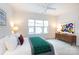 Spacious bedroom with a king-size bed, ceiling fan, and plenty of natural light at 412 Tristram Ln, Charlotte, NC 28205