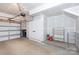 Spacious garage with extra storage shelving and room for two cars at 412 Tristram Ln, Charlotte, NC 28205