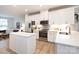 Modern kitchen with white cabinets, stainless steel appliances, and an island at 412 Tristram Ln, Charlotte, NC 28205