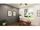 Home office with gray shiplap accent wall and a window overlooking the backyard at 1935 Weddington Rd # A, Matthews, NC 28105