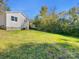 Spacious backyard with grassy area and trees at 305 Gooch St, Lancaster, SC 29720