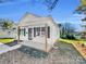 Modern white house with a porch and yard at 305 Gooch St, Lancaster, SC 29720