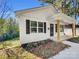 Newly built white house with a porch and walkway at 305 Gooch St, Lancaster, SC 29720