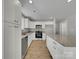 Modern kitchen with white cabinets, granite counters, and stainless steel appliances at 305 Gooch St, Lancaster, SC 29720