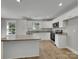 Modern kitchen with an island and granite countertops at 305 Gooch St, Lancaster, SC 29720