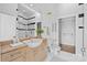 Well-lit bathroom featuring a large sink, vanity, and a walk-in shower with modern fixtures at 708 N Davidson St, Charlotte, NC 28202