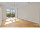 Bright bedroom with hardwood floors and large windows at 708 N Davidson St, Charlotte, NC 28202