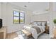 Bright bedroom featuring hardwood floors, neutral walls, and a picturesque window view at 708 N Davidson St, Charlotte, NC 28202