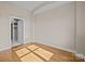 Spacious bedroom with hardwood floors and high ceilings at 708 N Davidson St, Charlotte, NC 28202