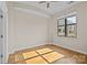 Well-lit bedroom with hardwood floors and large window at 708 N Davidson St, Charlotte, NC 28202