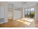 Light and airy living room with hardwood floors and large windows at 708 N Davidson St, Charlotte, NC 28202