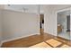 Open living area with hardwood floors and bathroom access at 708 N Davidson St, Charlotte, NC 28202