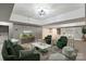 Finished basement with seating area and large TV at 128 Archbell Point Ln, Mooresville, NC 28117