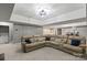 A comfortable finished basement with a large sectional sofa and stylish lighting at 128 Archbell Point Ln, Mooresville, NC 28117