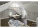 Upstairs bedroom with daybed and hardwood floors at 128 Archbell Point Ln, Mooresville, NC 28117