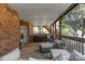 Cozy covered porch with an outdoor seating area and screened in structure at 128 Archbell Point Ln, Mooresville, NC 28117
