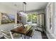 Bright dining room with a large table and lots of natural light at 128 Archbell Point Ln, Mooresville, NC 28117