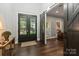 Elegant entryway with black double doors and a barn door at 128 Archbell Point Ln, Mooresville, NC 28117