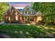 Brick house with a large front yard and mature trees at 128 Archbell Point Ln, Mooresville, NC 28117