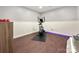 Basement gym with elliptical and weights at 128 Archbell Point Ln, Mooresville, NC 28117