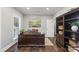 Spacious home office with built-in bookcases and a large desk at 128 Archbell Point Ln, Mooresville, NC 28117