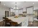 Modern kitchen with white cabinets and a large island at 128 Archbell Point Ln, Mooresville, NC 28117