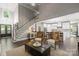 Open living room with a staircase and a view of the kitchen at 128 Archbell Point Ln, Mooresville, NC 28117
