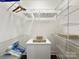 A well-organized walk-in closet with shelving and space for storage at 128 Archbell Point Ln, Mooresville, NC 28117