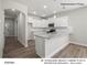 Modern kitchen featuring white cabinets, granite countertops, and stainless steel appliances at 209 Lake George Dr, Shelby, NC 28152