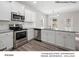 The modern kitchen features stainless steel appliances and granite counters at 209 Lake George Dr, Shelby, NC 28152