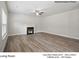 Cozy living room featuring hard floors, a fireplace, and ample natural light at 209 Lake George Dr, Shelby, NC 28152