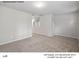 Spacious loft area with neutral carpet and walls, offering versatile living space in a new home at 209 Lake George Dr, Shelby, NC 28152