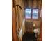 Elegant bathroom with warm lighting, decorative curtains, and dark tile flooring at 377 Riverwood Rd, Mooresville, NC 28117