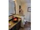 Charming bathroom featuring a marble countertop, vessel sink, and unique towel rack at 377 Riverwood Rd, Mooresville, NC 28117