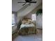 Cozy bedroom with sloped ceilings, a comfortable bed, and ample natural light from two windows at 377 Riverwood Rd, Mooresville, NC 28117