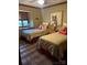 Bedroom with twin beds, a colorful owl picture on the wall, and natural light from the window at 377 Riverwood Rd, Mooresville, NC 28117