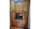 Charming butler's pantry featuring custom cabinetry, granite countertops, and built-in coffee station at 377 Riverwood Rd, Mooresville, NC 28117