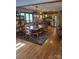 Spacious dining area featuring a unique wooden table with bench seating, hardwood floors, and plenty of natural light at 377 Riverwood Rd, Mooresville, NC 28117