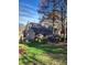 Stately home with mature landscaping, large windows, and attached two car garage at 377 Riverwood Rd, Mooresville, NC 28117