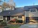 Contemporary home exterior with modern architecture, garage, and landscaped yard at 377 Riverwood Rd, Mooresville, NC 28117