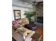 Inviting living room with a stone fireplace and plush furnishings at 377 Riverwood Rd, Mooresville, NC 28117