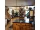 Bright, open-concept living area showcases hardwood floors, a stone fireplace, and seamlessly connects to the dining area at 377 Riverwood Rd, Mooresville, NC 28117