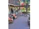 Expansive backyard deck featuring an outdoor kitchen, dining area, and lounge seating with mature trees at 377 Riverwood Rd, Mooresville, NC 28117