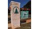 Brick entrance sign for Pine Trace Neighborhood featuring a green tree emblem and wooden accents at 4049 Port Richmond Ave # 11, Gastonia, NC 28056