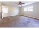 Spacious bedroom featuring neutral walls, carpet floors, a ceiling fan and a window for lots of natural light at 349 Dublin Ct, Gastonia, NC 28054