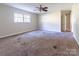 Spacious bedroom featuring neutral walls, carpet floors, a ceiling fan and a window for lots of natural light at 349 Dublin Ct, Gastonia, NC 28054