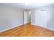 Bedroom with hardwood floors, a double-door closet, and a doorway is visible at 349 Dublin Ct, Gastonia, NC 28054