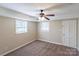 Cozy bedroom featuring a ceiling fan, neutral carpet, and natural light from a window at 349 Dublin Ct, Gastonia, NC 28054