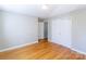 A bright bedroom featuring hardwood floors and a double-door closet for ample storage at 349 Dublin Ct, Gastonia, NC 28054